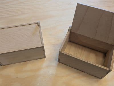 Wooden box with hinged lid