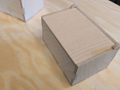 Wooden box with hinged lid